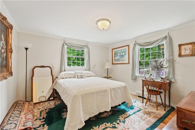 4914 Simmons Circle Export, PA 15632 - Photo 21 of 33 a bedroom with a bed a table and windows