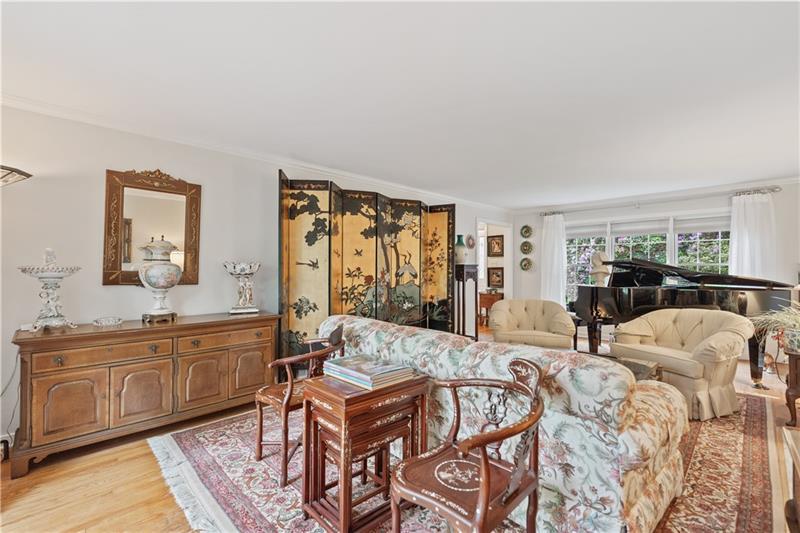 4914 Simmons Circle Export, PA 15632 - Photo 8 of 33 a living room with furniture a table and kitchen view