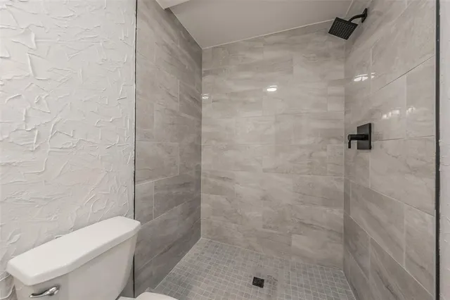 a bathroom with a sink toilet and vanity