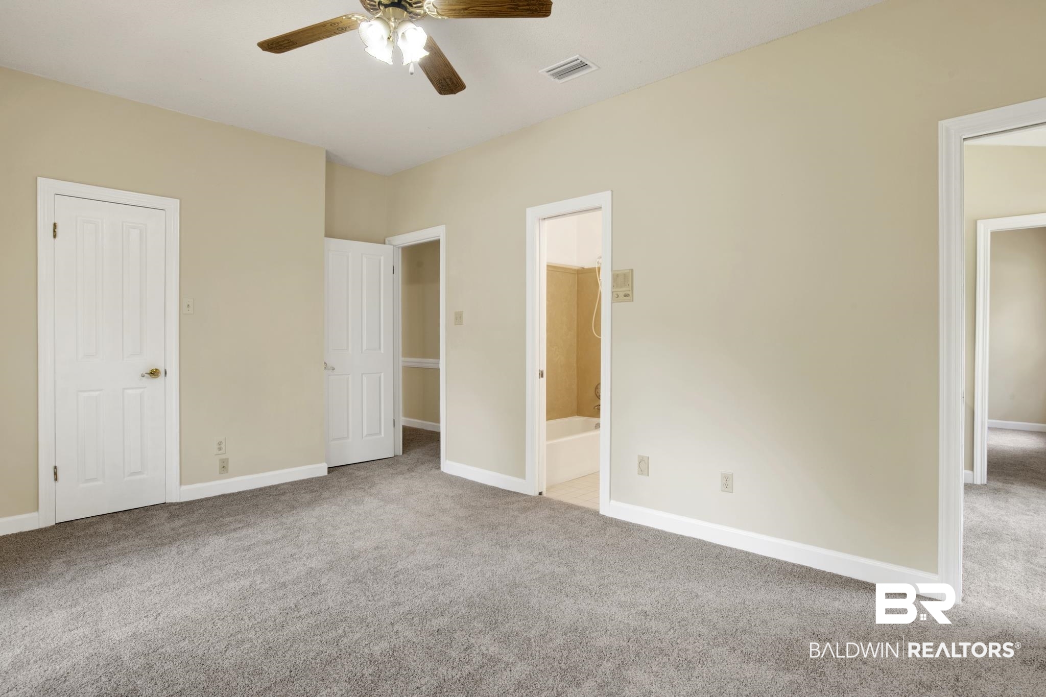 6805 Hunters Court Mobile, AL 36695 - Photo 23 of 37 Unfurnished bedroom with carpet flooring, baseboards, ensuite bath, and a ceiling fan