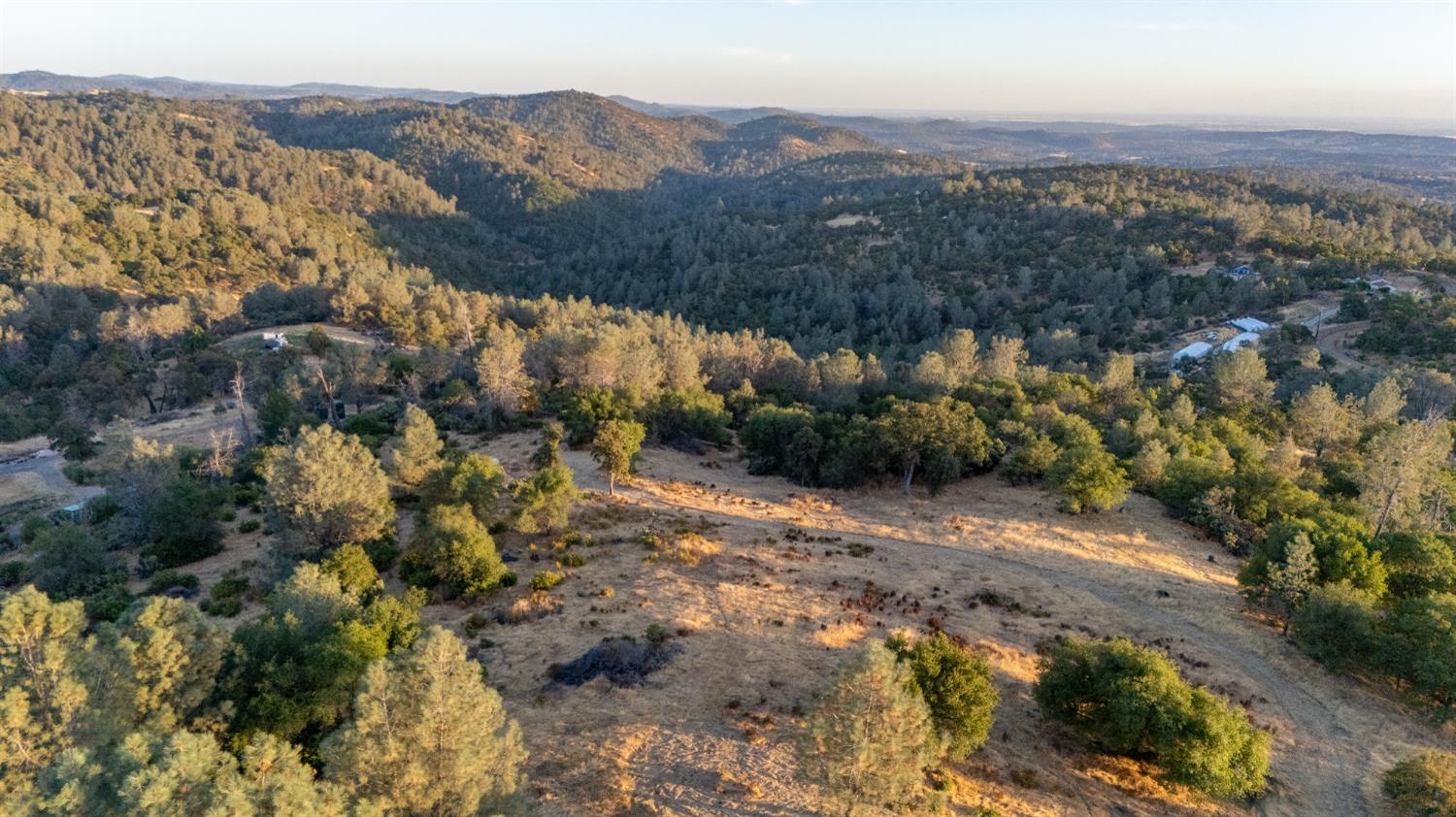21088 Dalzell Road Smartsville, CA 95977 - Photo 29 of 36 an aerial view of mountain with residential house and green space