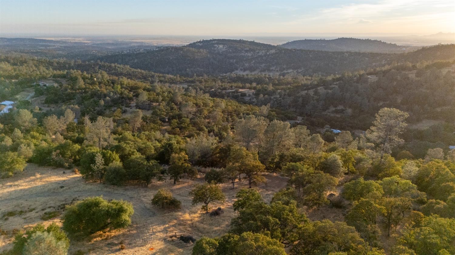 21088 Dalzell Road Smartsville, CA 95977 - Photo 30 of 36 a view of a forest with mountains in the background