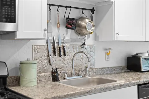 a bathroom with a sink mirror vanity and toilet