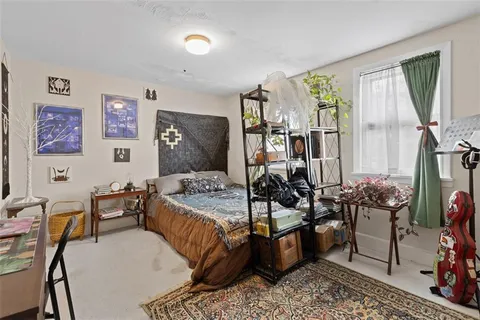 a room with toys and dresser