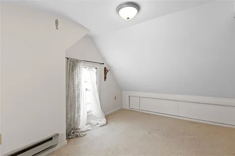 a view of a yard with large trees