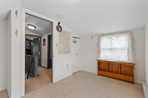 a view of house with a yard