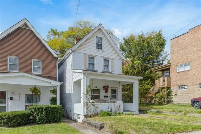 front view of a house with a yard