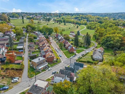 an aerial view of residential building and lake