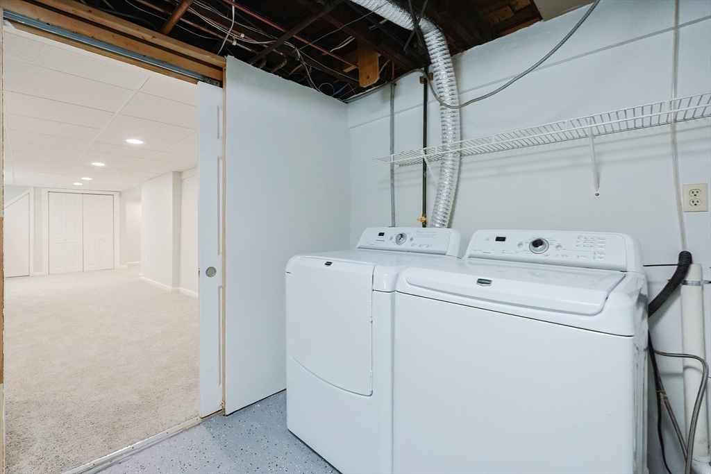 19 Arlington Road Waltham, MA 02453 - Photo 39 of 40 a utility room with dryer and washer