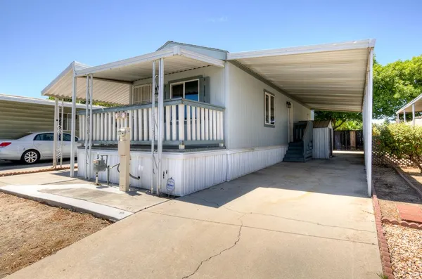 a front view of a house with garage