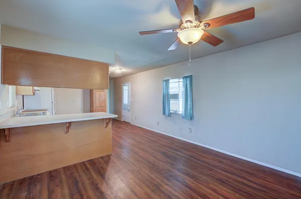 a view of kitchen with granite countertop cabinets a sink and dishwasher in it