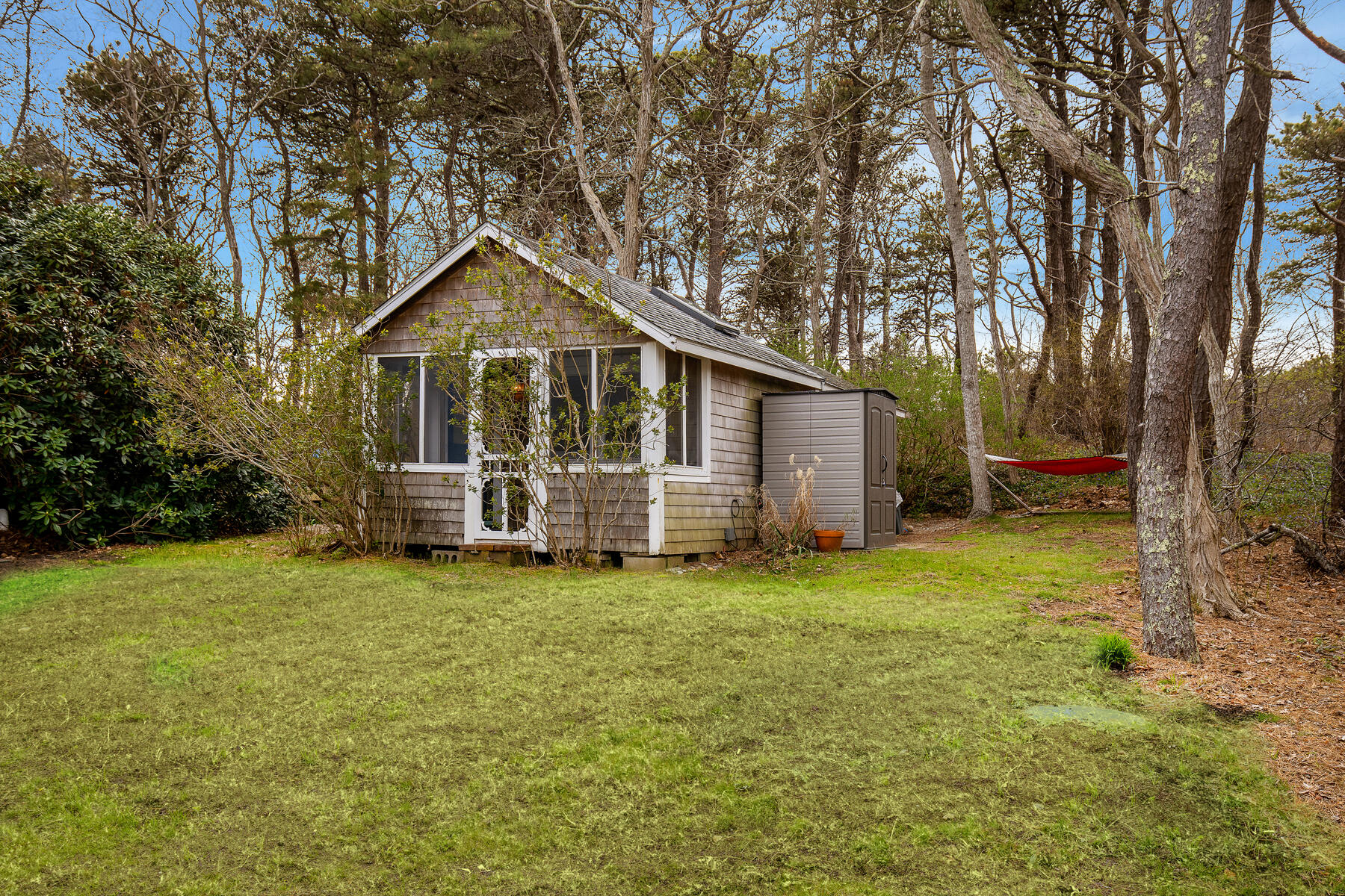 82 Shore Road, Unit 9 Truro, MA 02666 - Photo 30 of 36 a view of a house with a yard