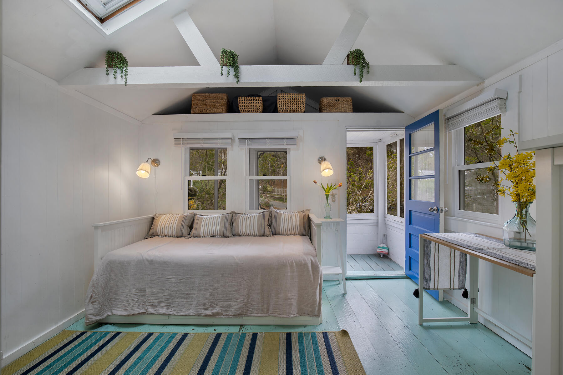 82 Shore Road, Unit 9 Truro, MA 02666 - Photo 3 of 36 a bedroom with a bed and wooden floor