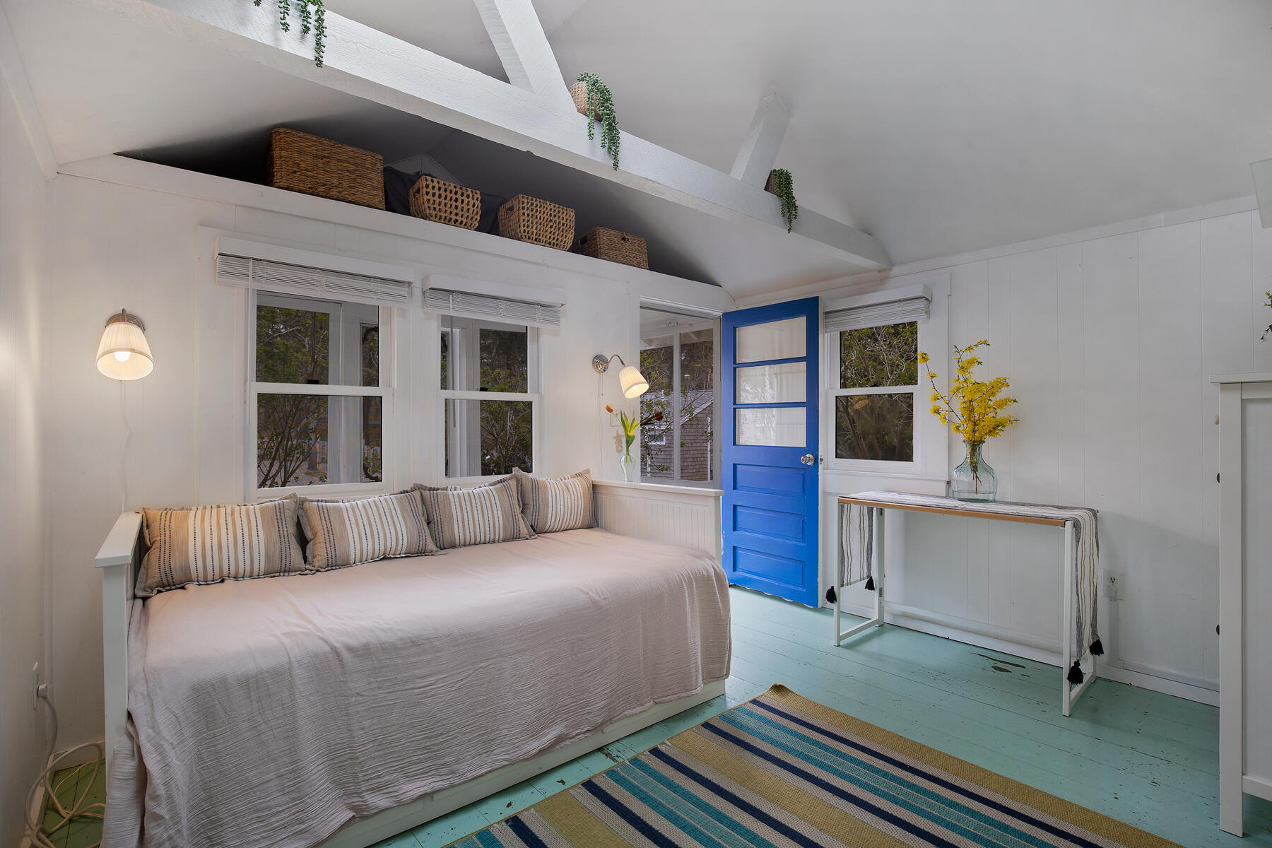82 Shore Road, Unit 9 Truro, MA 02666 - Photo 4 of 36 a bedroom with a large bed and a window