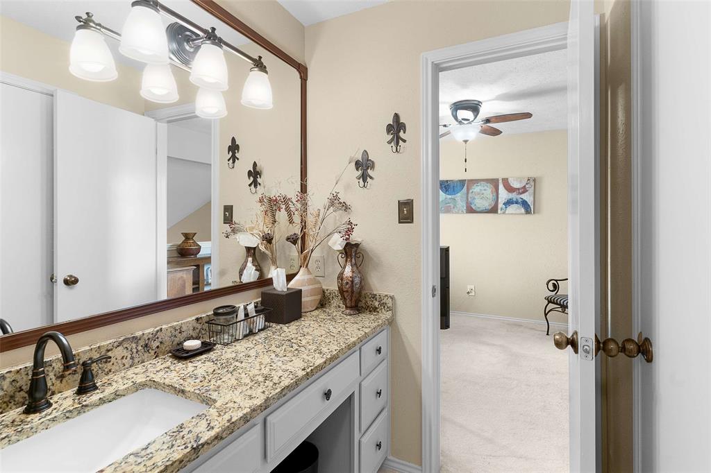 14683 Plage Lane Addison, TX 75001 - Photo 19 of 39 Bathroom featuring vanity, light colored carpet, and a ceiling fan