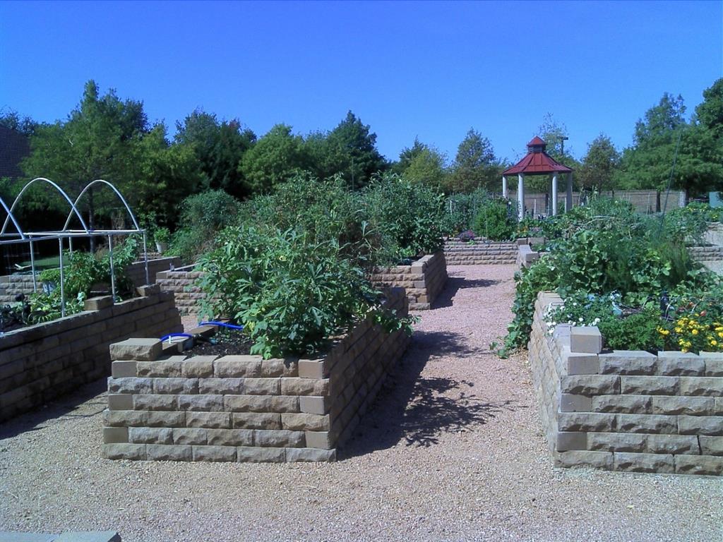 14683 Plage Lane Addison, TX 75001 - Photo 32 of 39 Community Garden featuring flower and vegetable planters