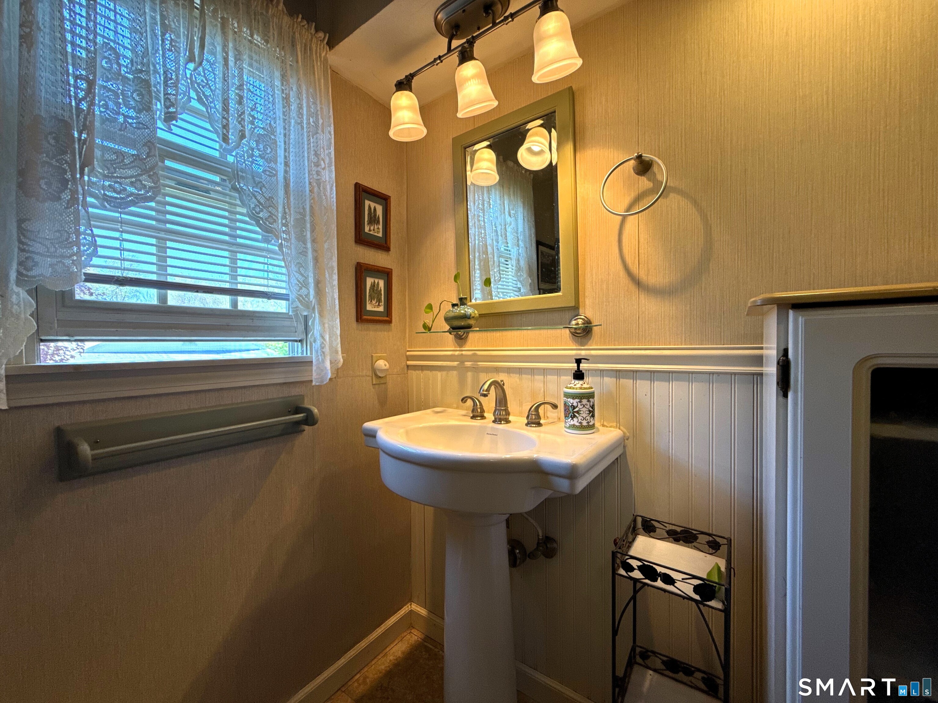 15 Grove Street Deep River, CT 06417 - Photo 18 of 25 a bathroom with a sink and a mirror