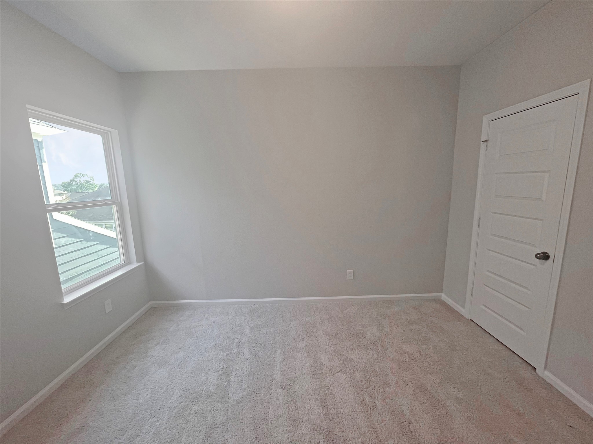 9765 Enclave Ridge Road Willis, TX 77318 - Photo 15 of 18 a view of an empty room with a window