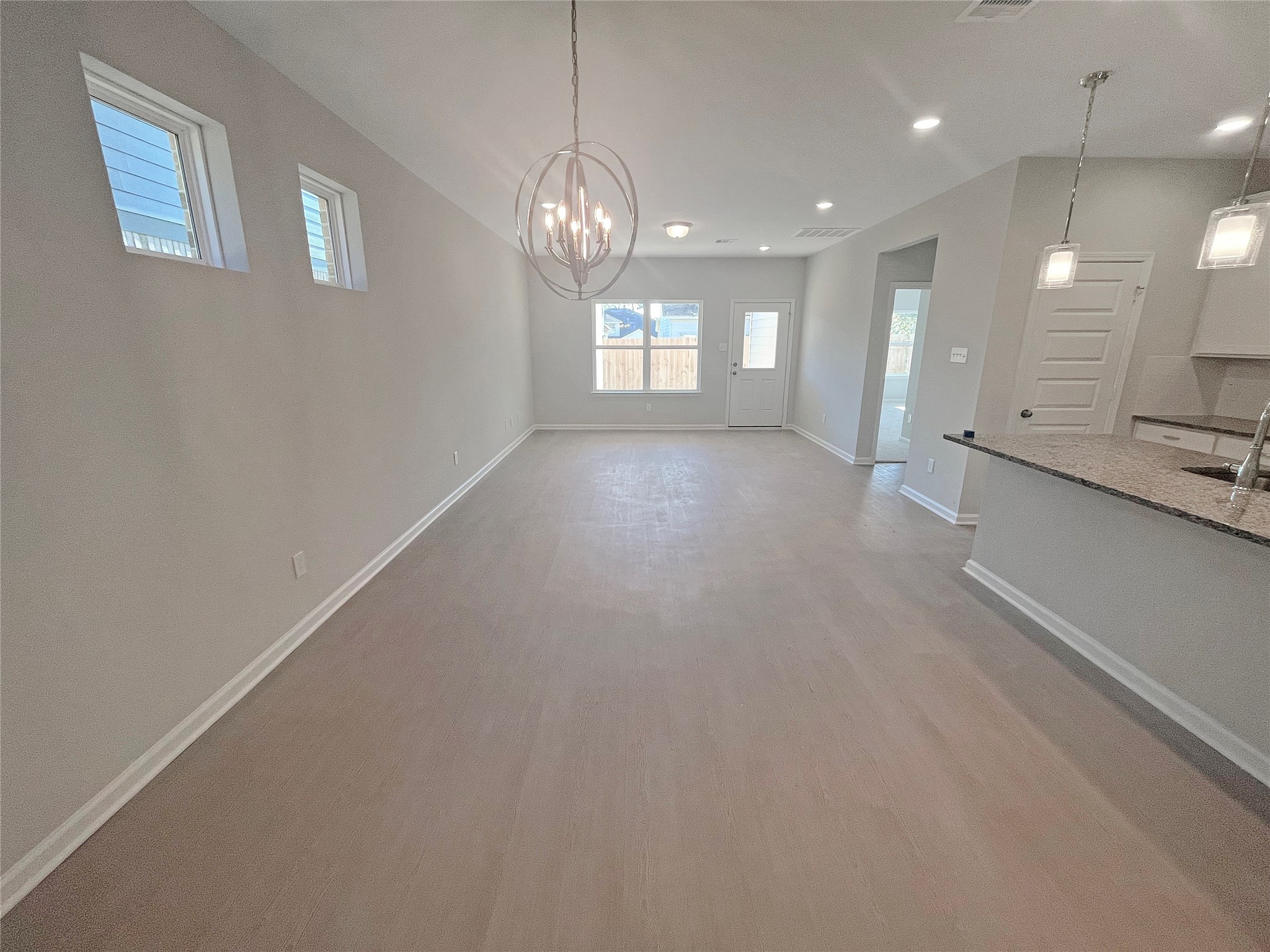 9765 Enclave Ridge Road Willis, TX 77318 - Photo 3 of 18 a view of a hallway with chandelier