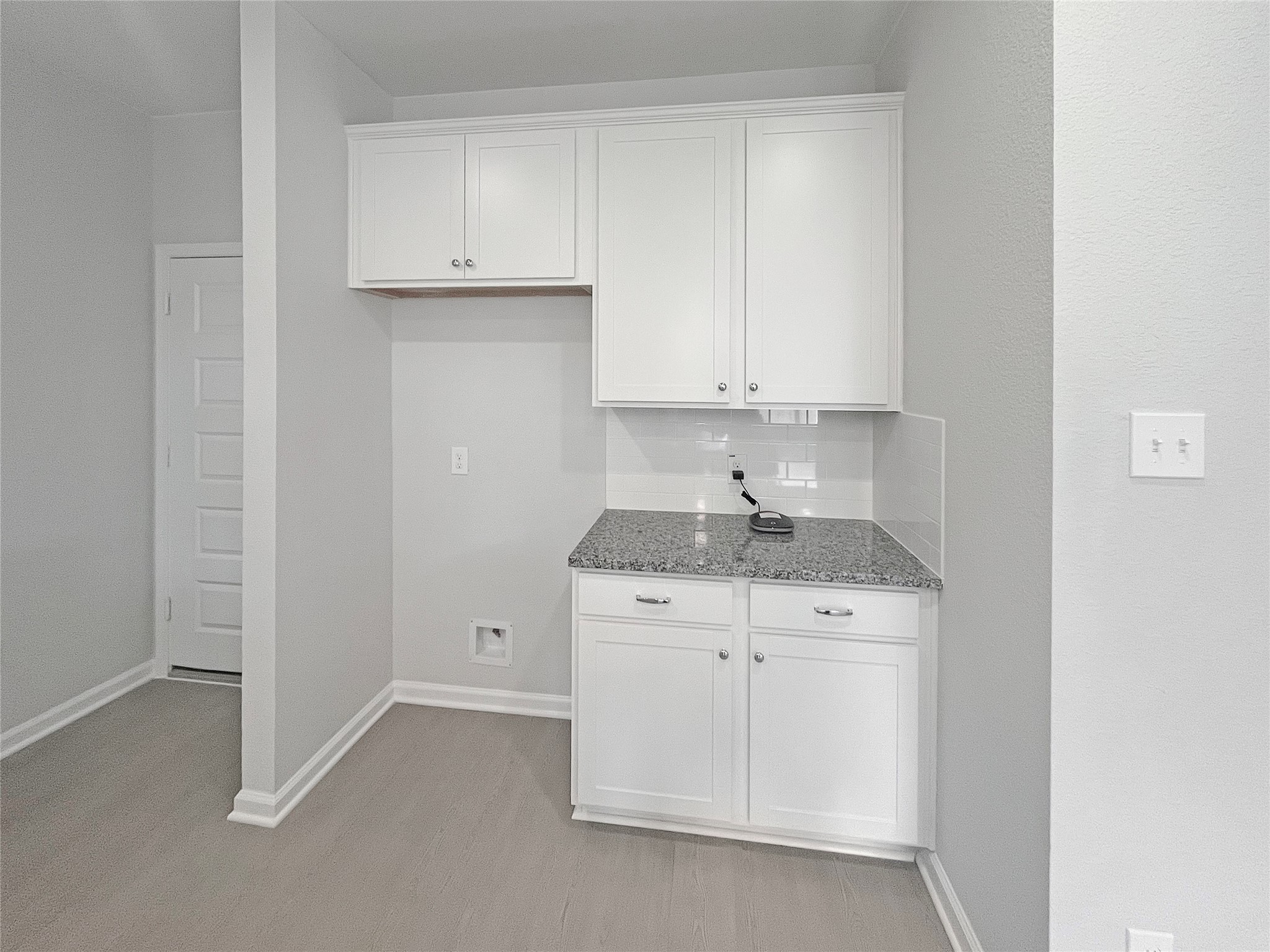 9765 Enclave Ridge Road Willis, TX 77318 - Photo 5 of 18 a kitchen with granite countertop white cabinets and a sink