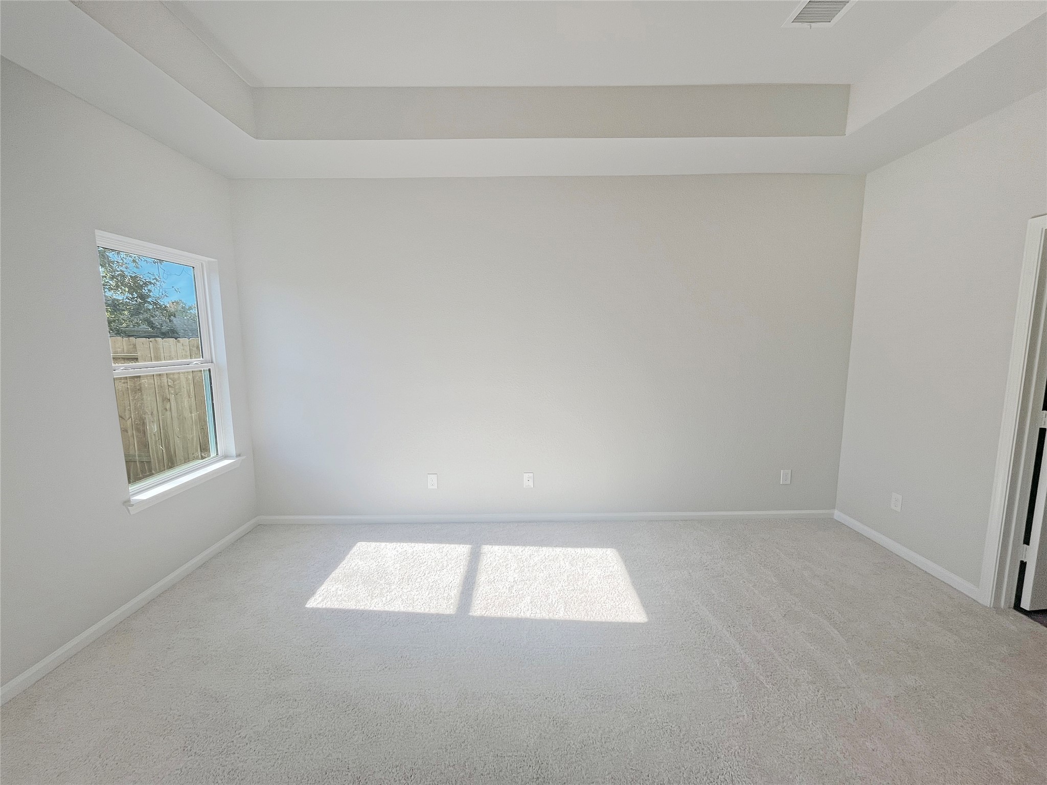 9765 Enclave Ridge Road Willis, TX 77318 - Photo 9 of 18 an empty room with windows