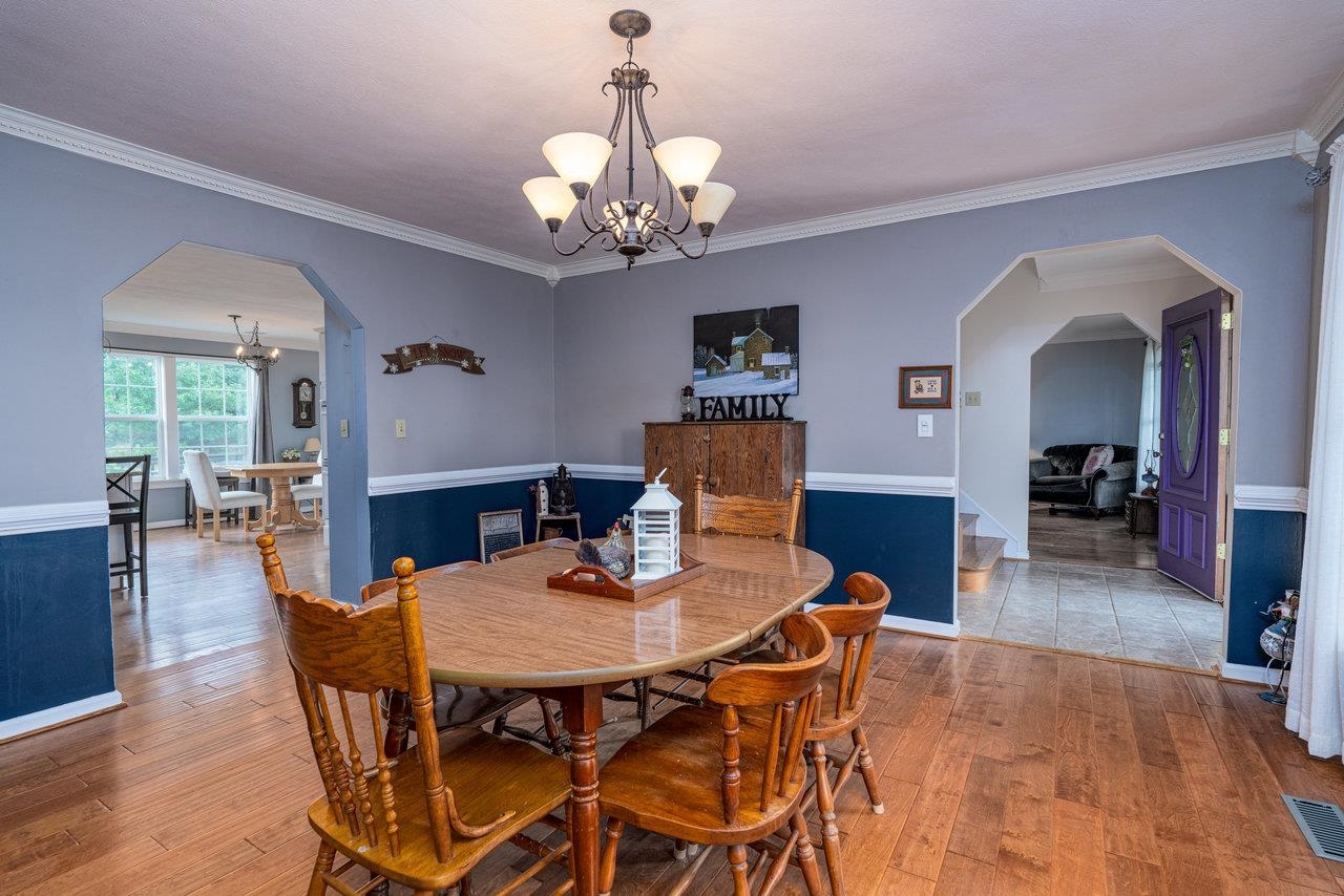 328 Morton Road Crimora, VA 24431 - Photo 7 of 32 a view of a dining room with furniture and wooden floor