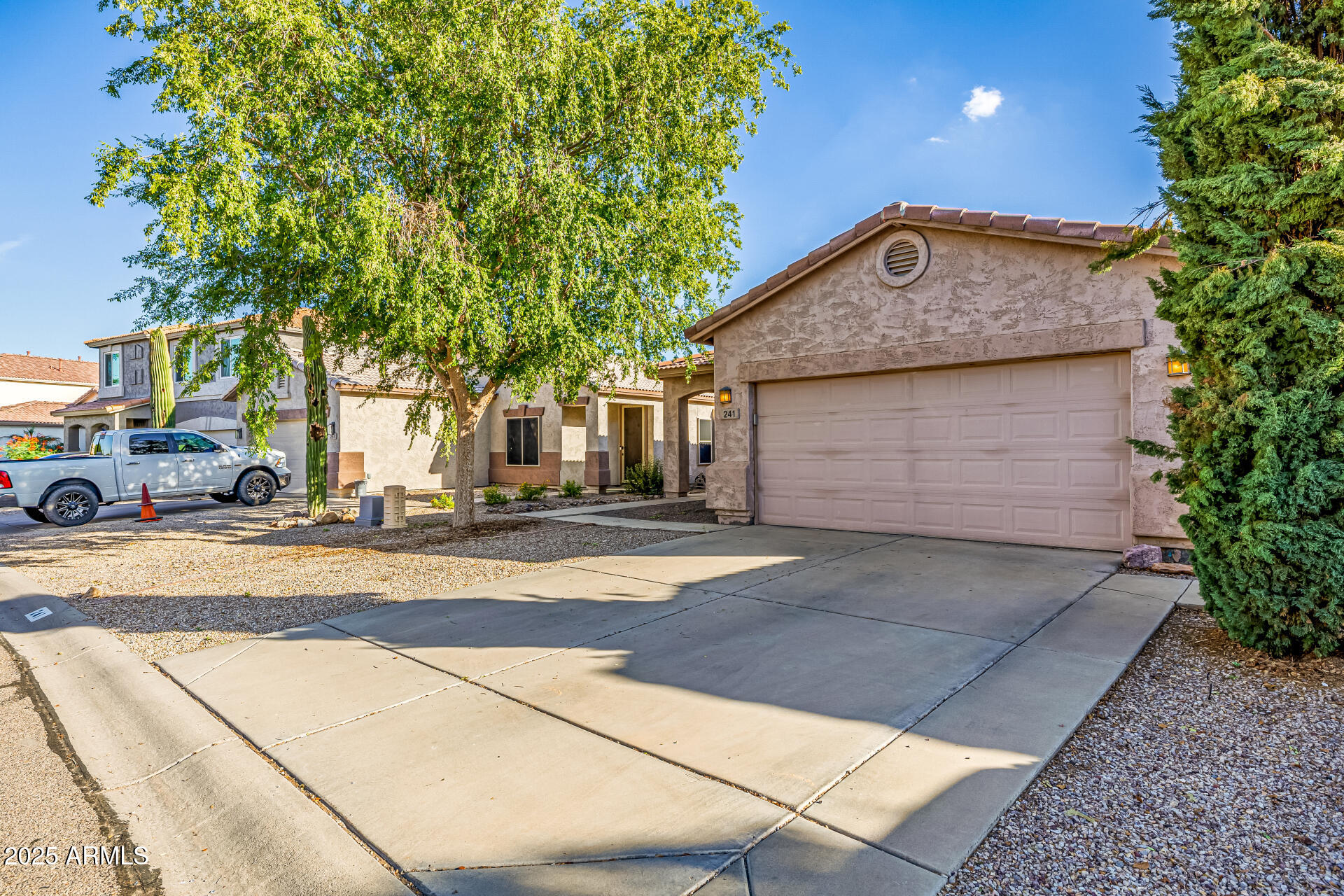 241 Mountain View Road San Tan Valley, AZ 85143 - Photo 11 of 62 a front view of a house with a garden
