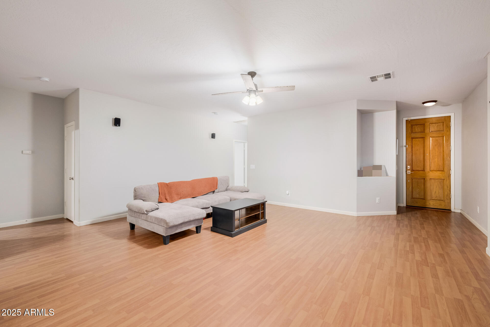 241 Mountain View Road San Tan Valley, AZ 85143 - Photo 18 of 62 a living room with furniture and wooden floor