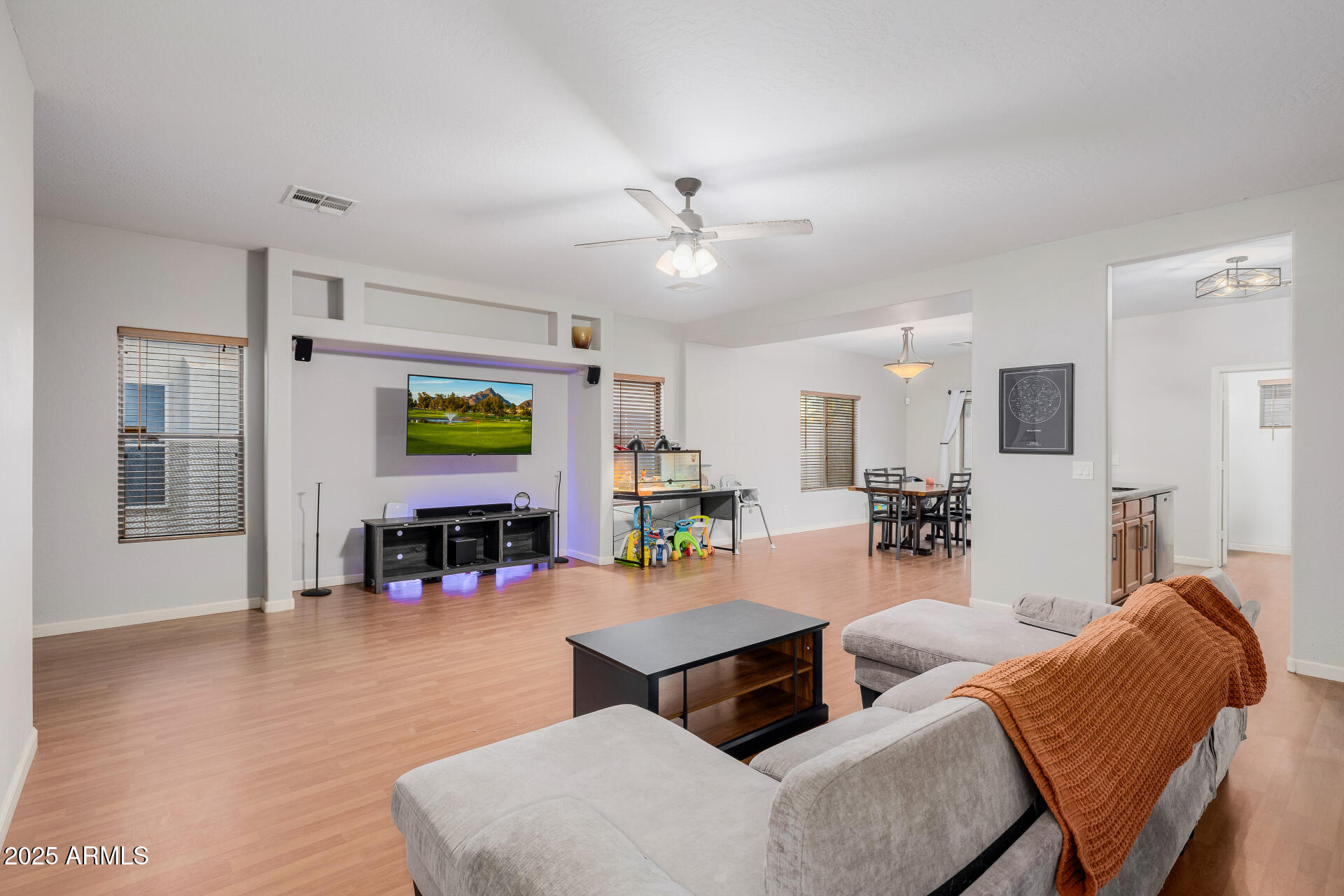 241 Mountain View Road San Tan Valley, AZ 85143 - Photo 19 of 62 a living room with furniture and a fireplace