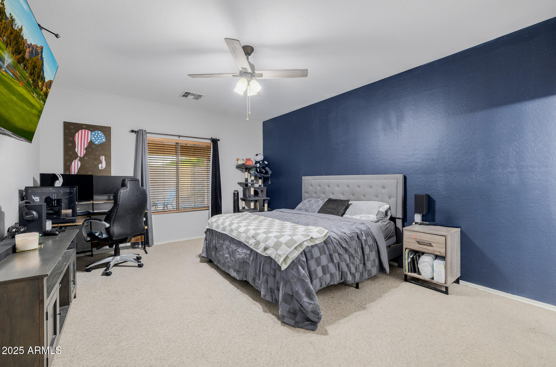 241 Mountain View Road San Tan Valley, AZ 85143 - Photo 34 of 62 a spacious bedroom with a bed and a chandelier