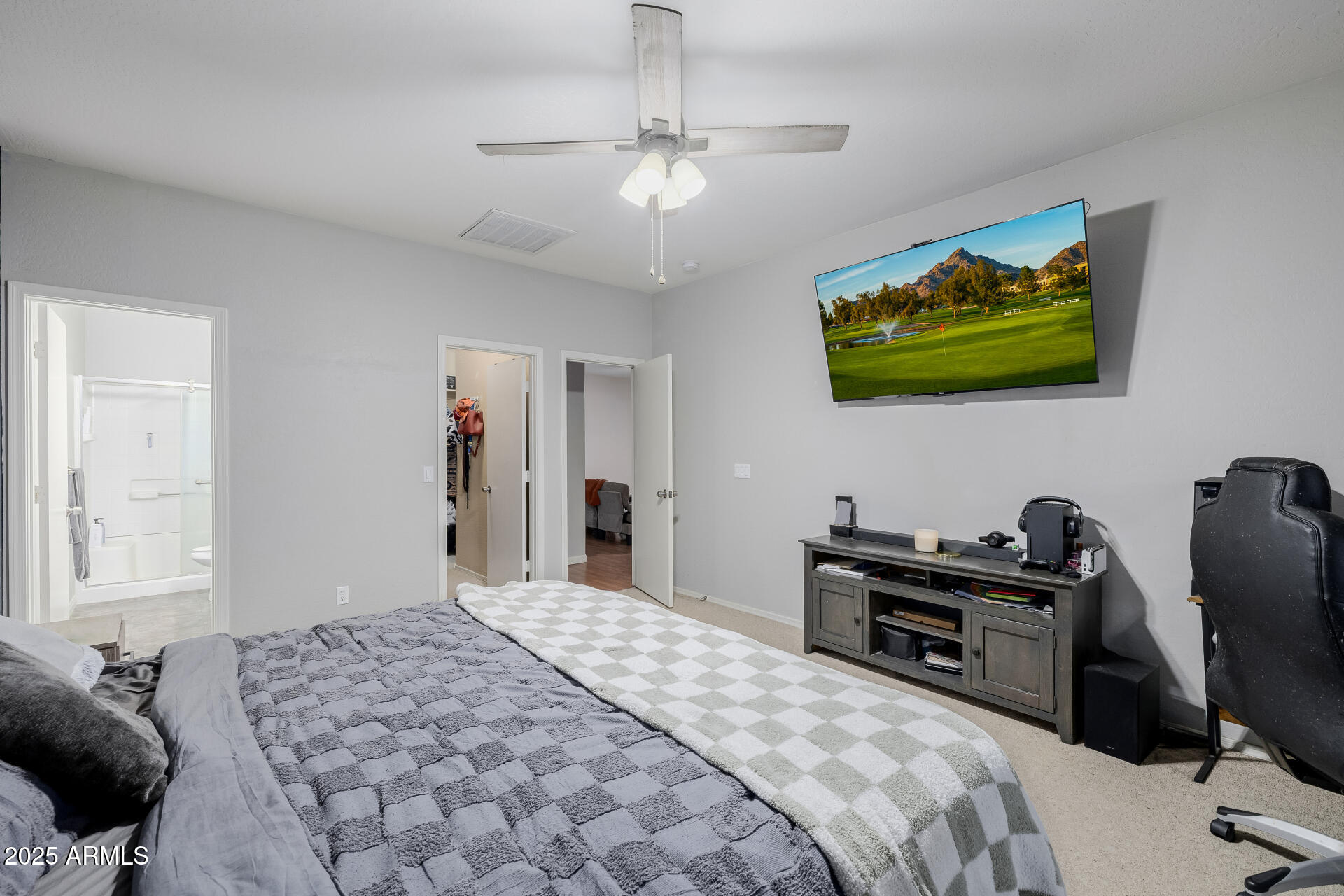 241 Mountain View Road San Tan Valley, AZ 85143 - Photo 35 of 62 a bedroom with a bed and a flat screen tv