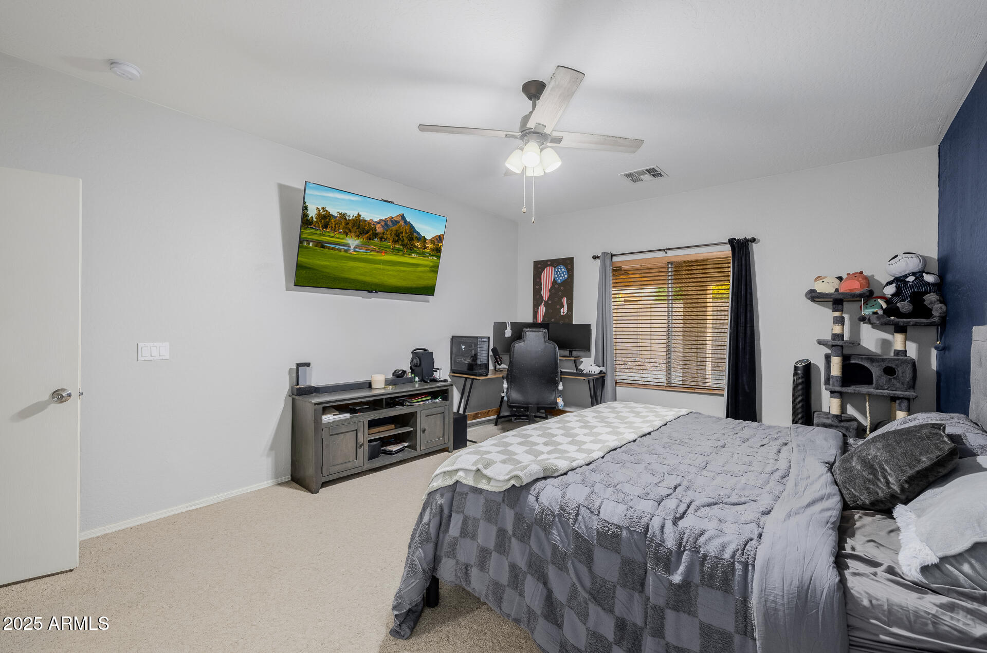 241 Mountain View Road San Tan Valley, AZ 85143 - Photo 36 of 62 a bedroom with a bed and a flat screen tv