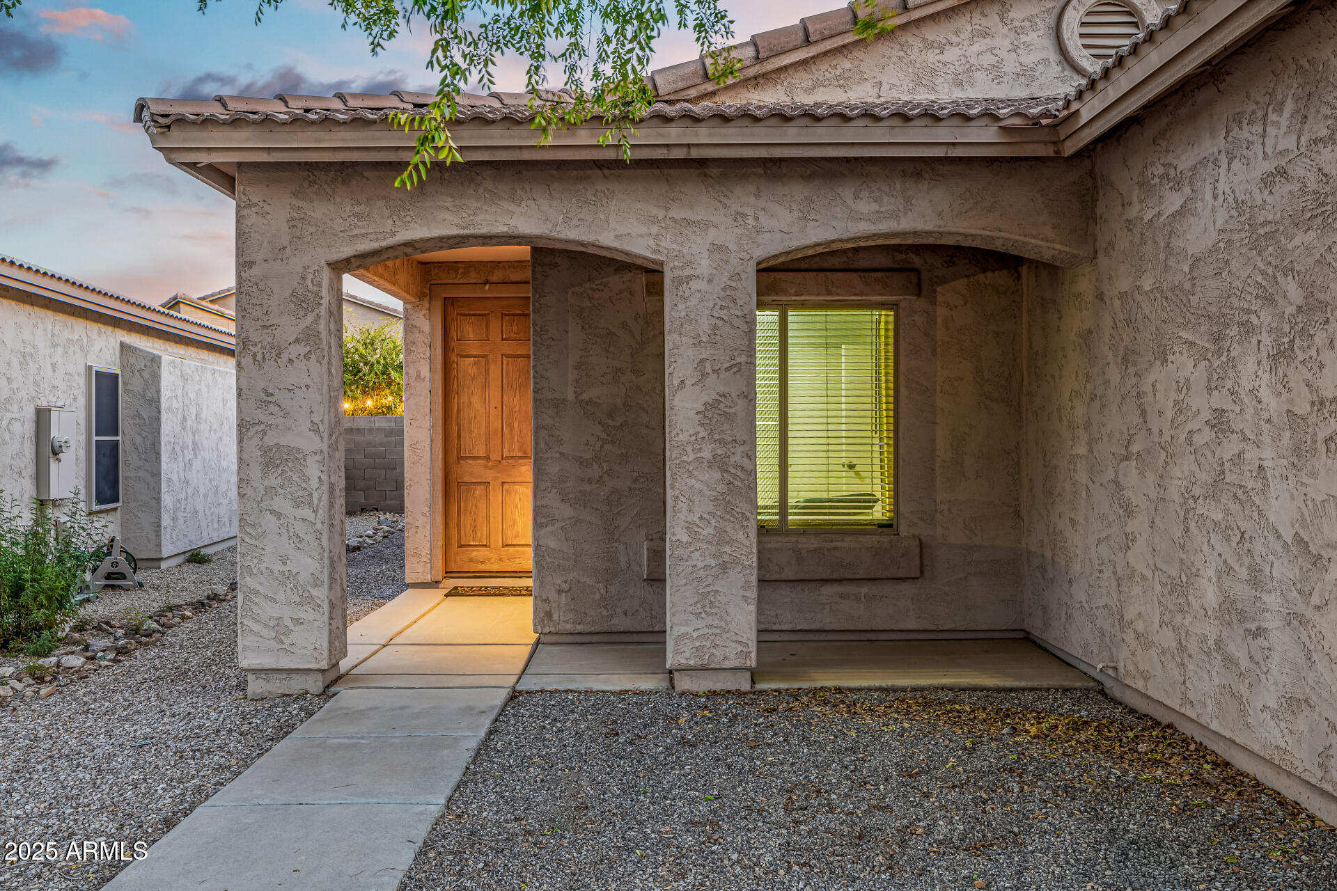 241 Mountain View Road San Tan Valley, AZ 85143 - Photo 7 of 62 a view of yellow house with a large window