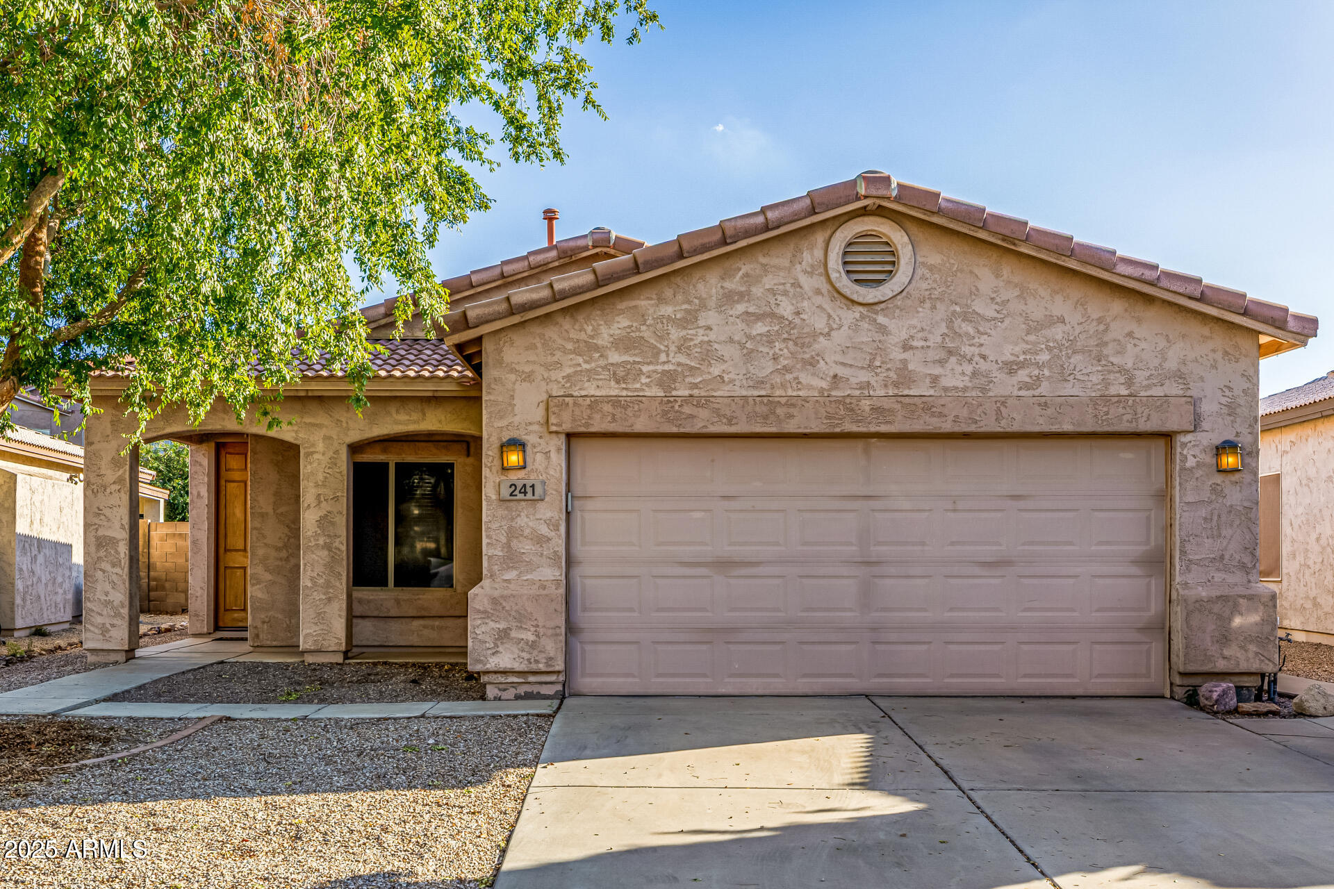 241 Mountain View Road San Tan Valley, AZ 85143 - Photo 10 of 62 a front view of a house with parking space
