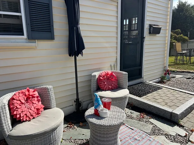 a view of a chairs and table in the patio