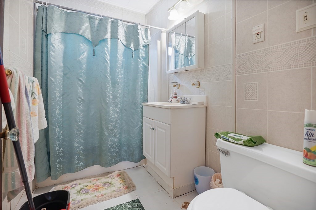 237-239 White Street Springfield, MA 01108 - Photo 11 of 31 a bathroom with a sink a toilet and shower