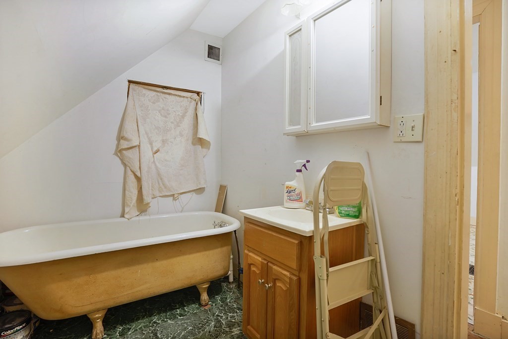 237-239 White Street Springfield, MA 01108 - Photo 15 of 31 a bathroom with a sink and a mirror