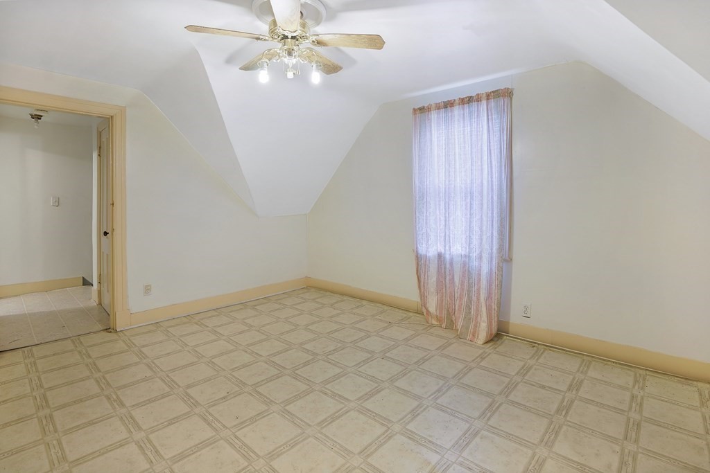 237-239 White Street Springfield, MA 01108 - Photo 16 of 31 an empty room with closet and fan