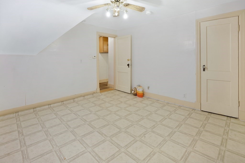 237-239 White Street Springfield, MA 01108 - Photo 17 of 31 a view of a room with a chandelier fan and carpet
