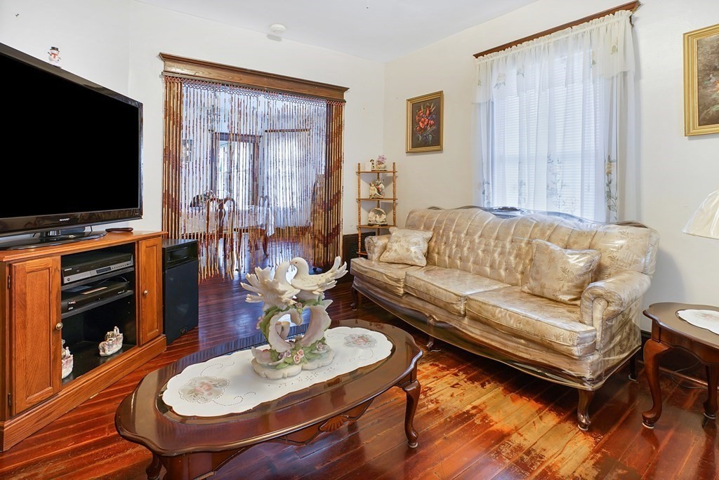 237-239 White Street Springfield, MA 01108 - Photo 22 of 31 a living room with furniture and a flat screen tv