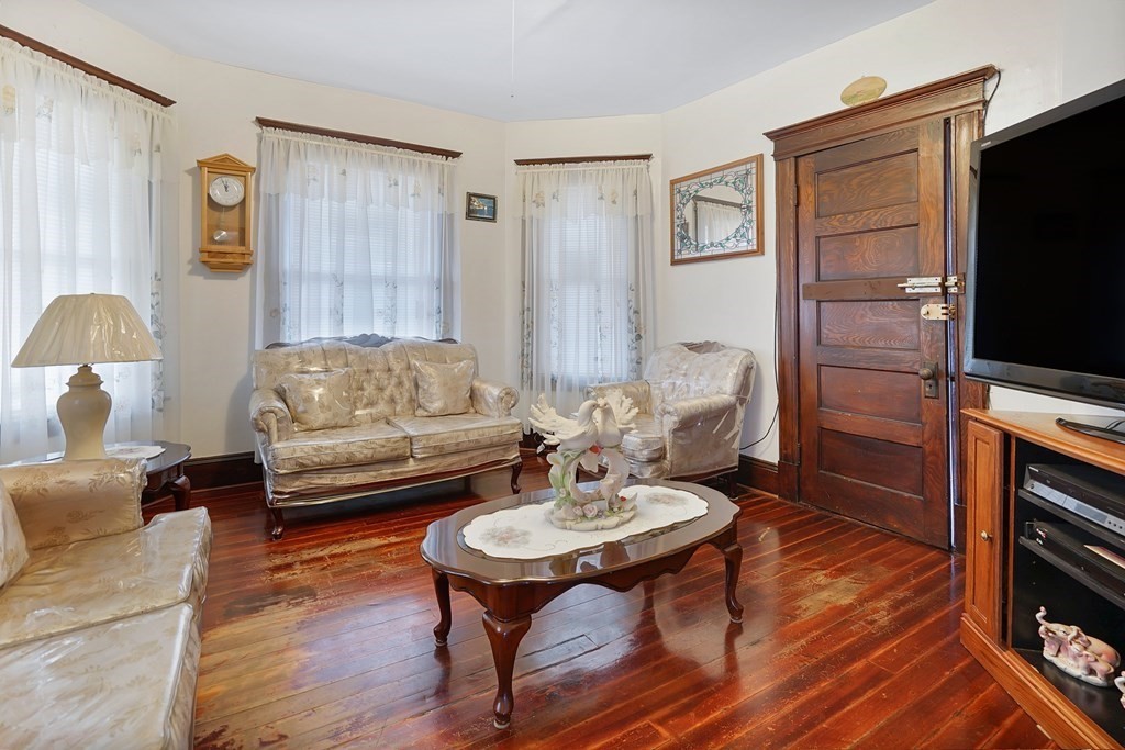 237-239 White Street Springfield, MA 01108 - Photo 23 of 31 a living room with furniture and a flat screen tv