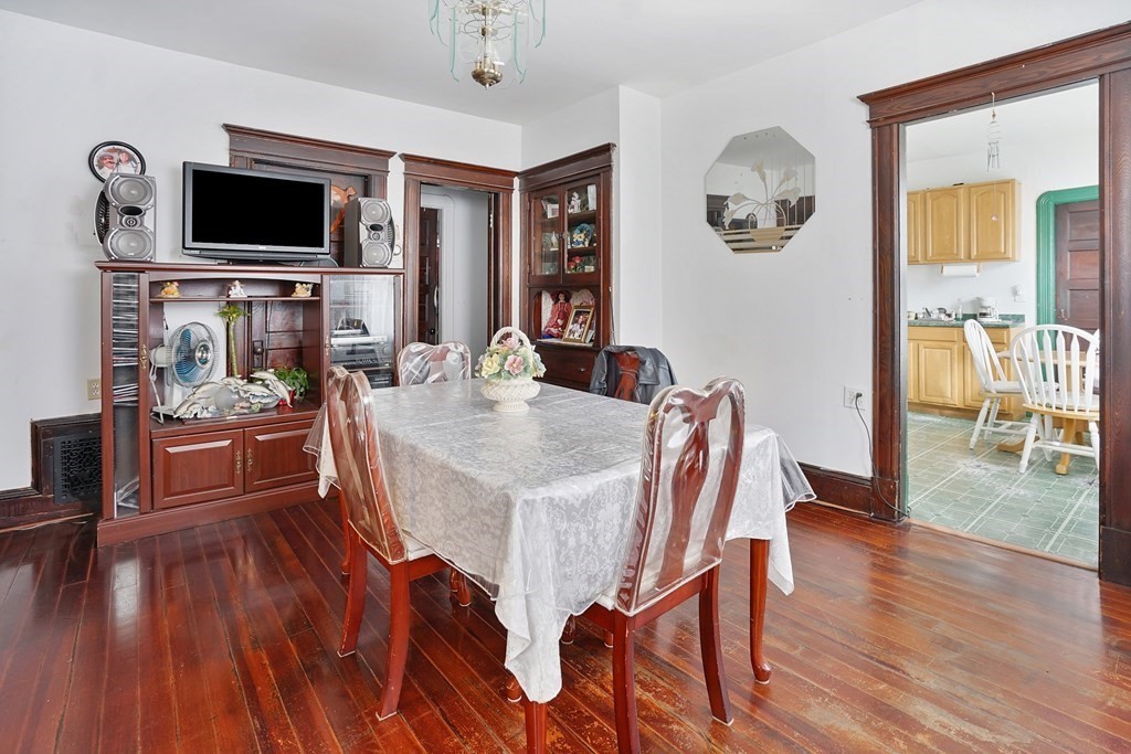237-239 White Street Springfield, MA 01108 - Photo 24 of 31 a view of a dining room with furniture window and wooden floor