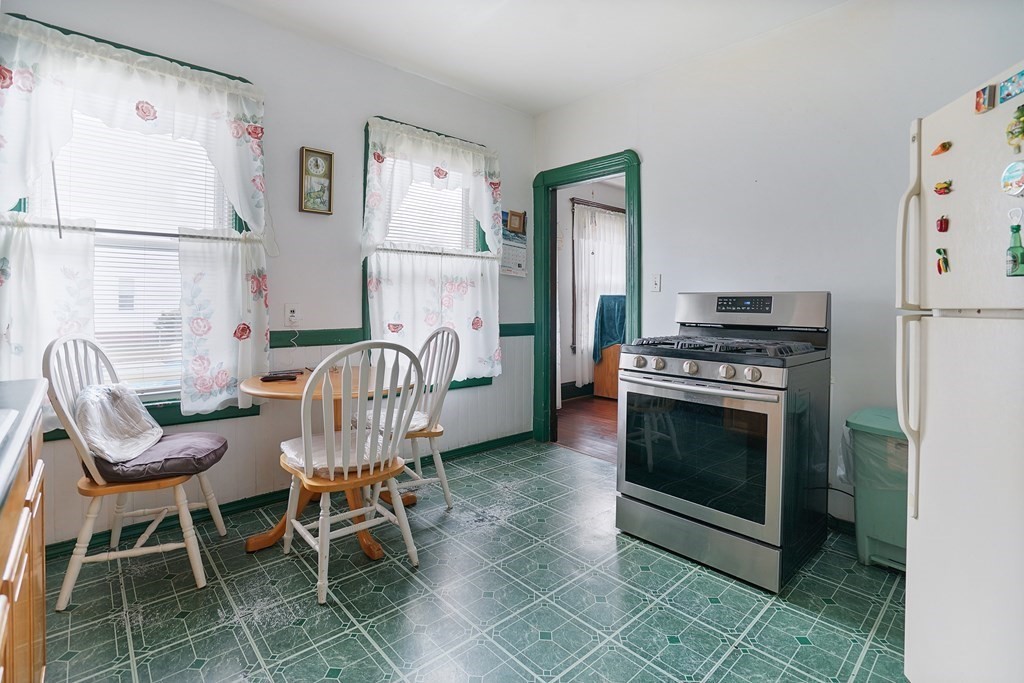 237-239 White Street Springfield, MA 01108 - Photo 27 of 31 a dining room with furniture and wooden floor