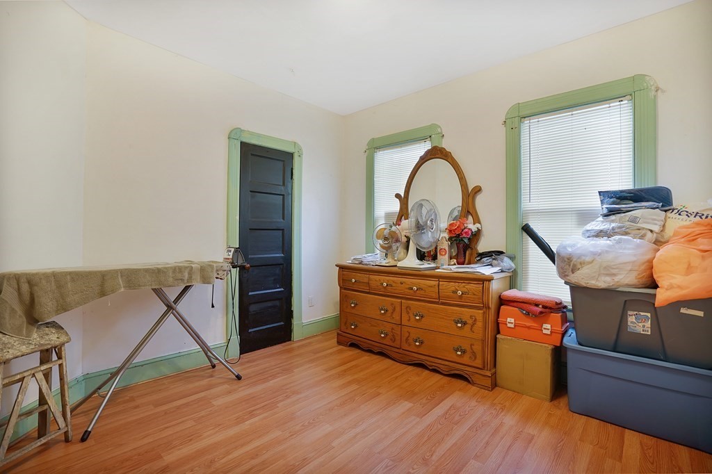 237-239 White Street Springfield, MA 01108 - Photo 28 of 31 a bed room with a bed and a dresser
