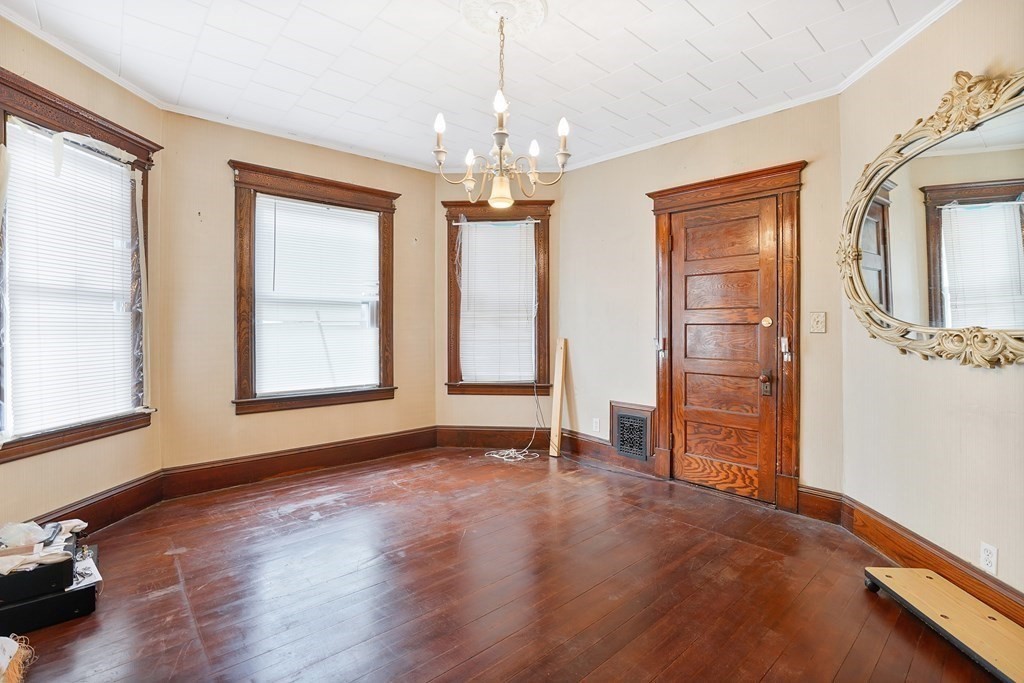 237-239 White Street Springfield, MA 01108 - Photo 3 of 31 a view of livingroom with hardwood floor and window