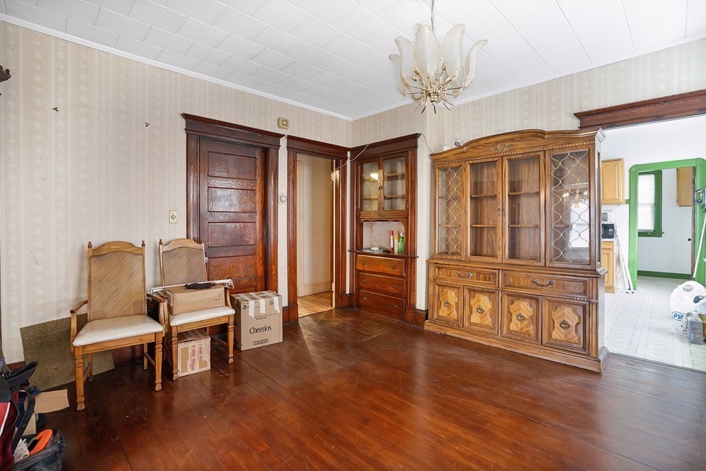 237-239 White Street Springfield, MA 01108 - Photo 4 of 31 a living room with furniture and a chandelier