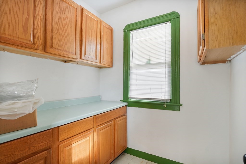 237-239 White Street Springfield, MA 01108 - Photo 7 of 31 a kitchen with a sink and a window