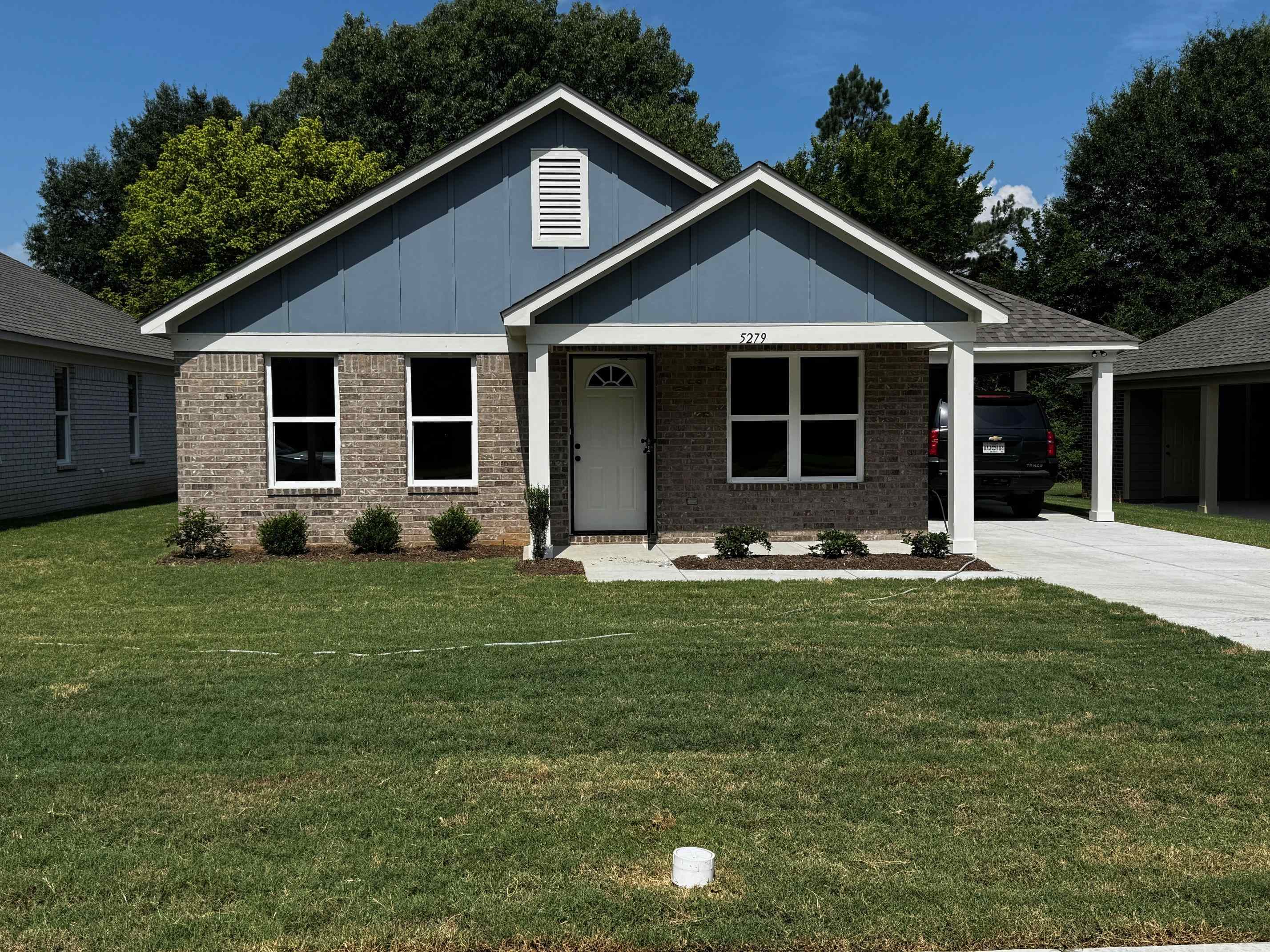 5279 Zodiac Road Memphis, TN 38118 - Photo 1 of 22 a front view of a house with a yard