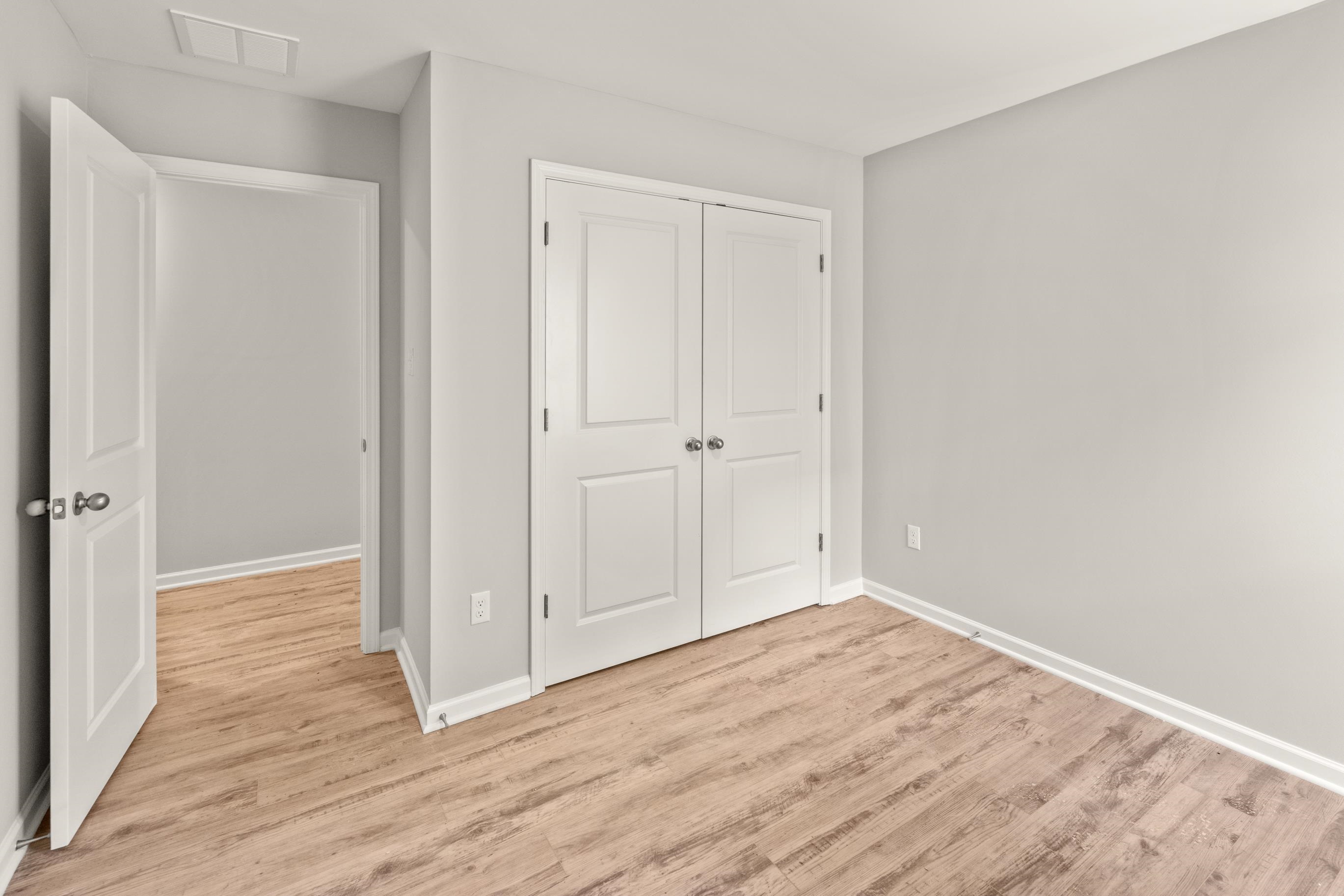 5279 Zodiac Road Memphis, TN 38118 - Photo 14 of 22 a view of an empty room with wooden floor