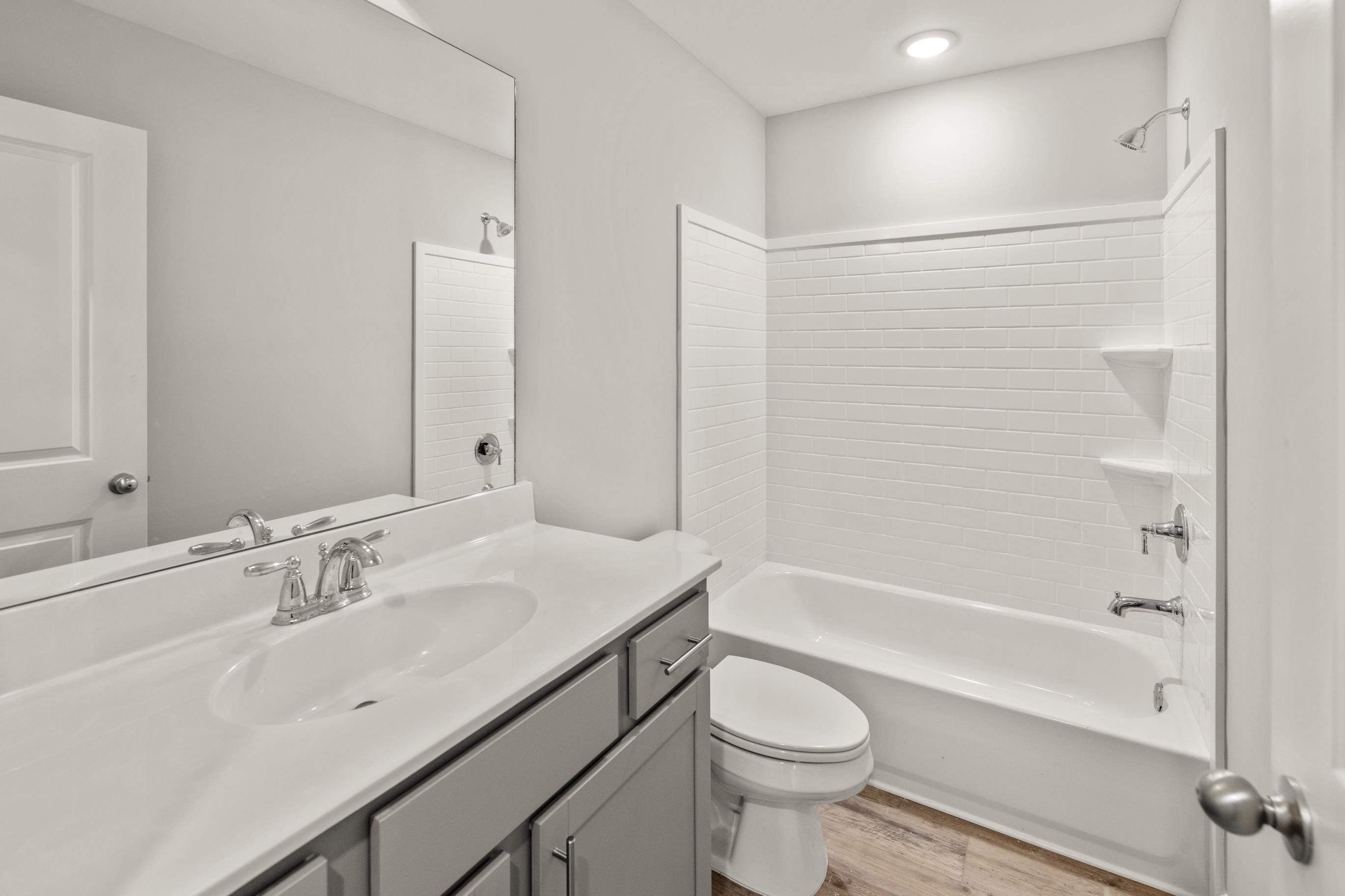 5279 Zodiac Road Memphis, TN 38118 - Photo 15 of 22 a bathroom with a sink a toilet and shower